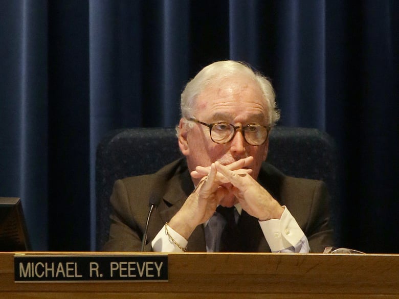California Public Utilities Commission President Michael Peevey listens to public comments during a meeting of the five-member commission in San Francisco, Thursday, Dec. 18, 2014. 